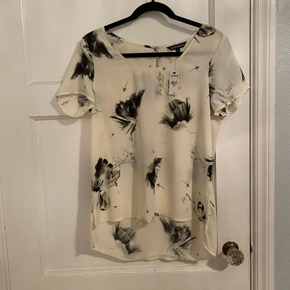 Off white/ black floral blouse (high/ low). Brand new, tags on, from Express.